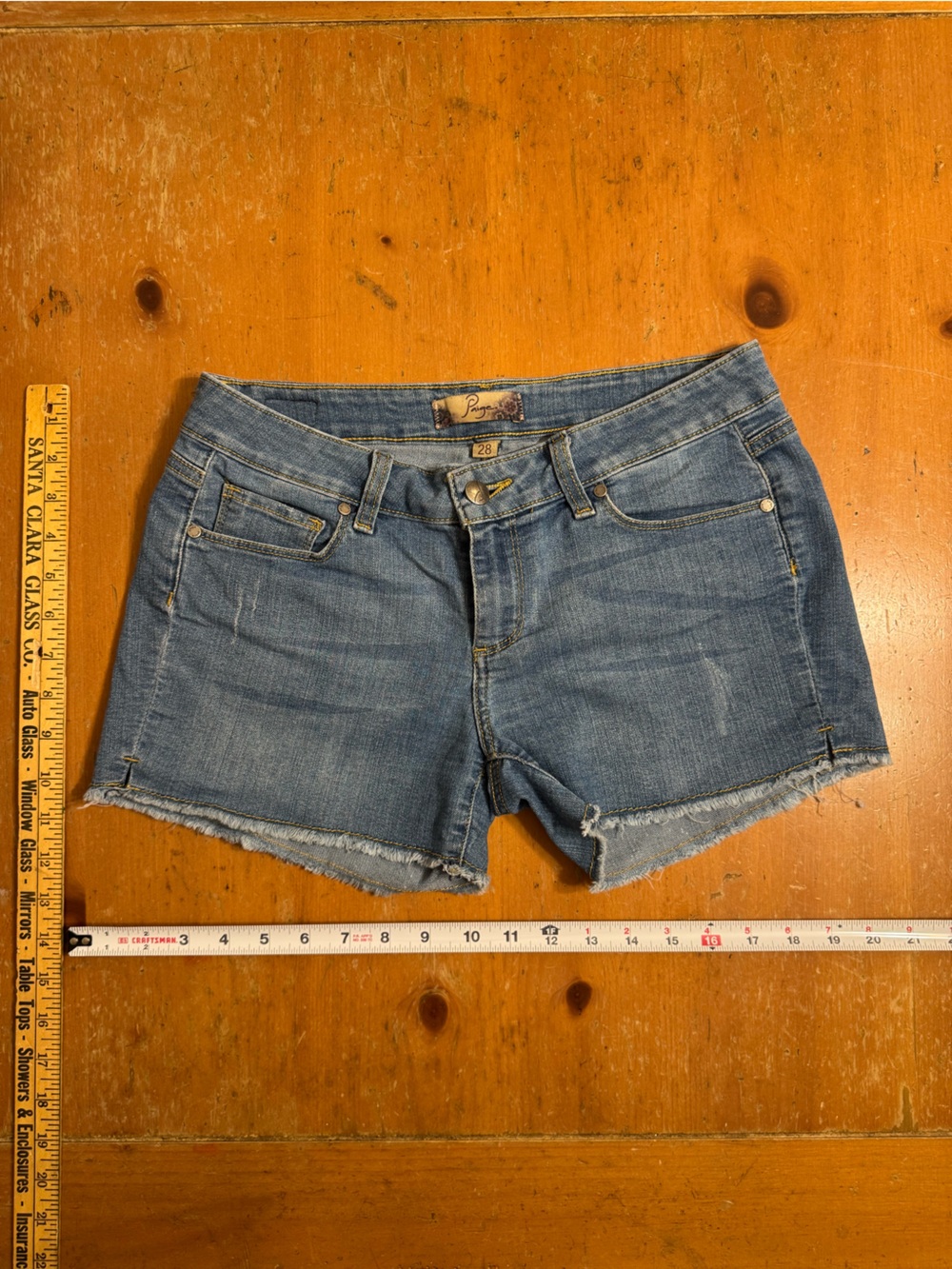 PAIGE Medium Blue Denim Frayed Hem Cutoff Shorts